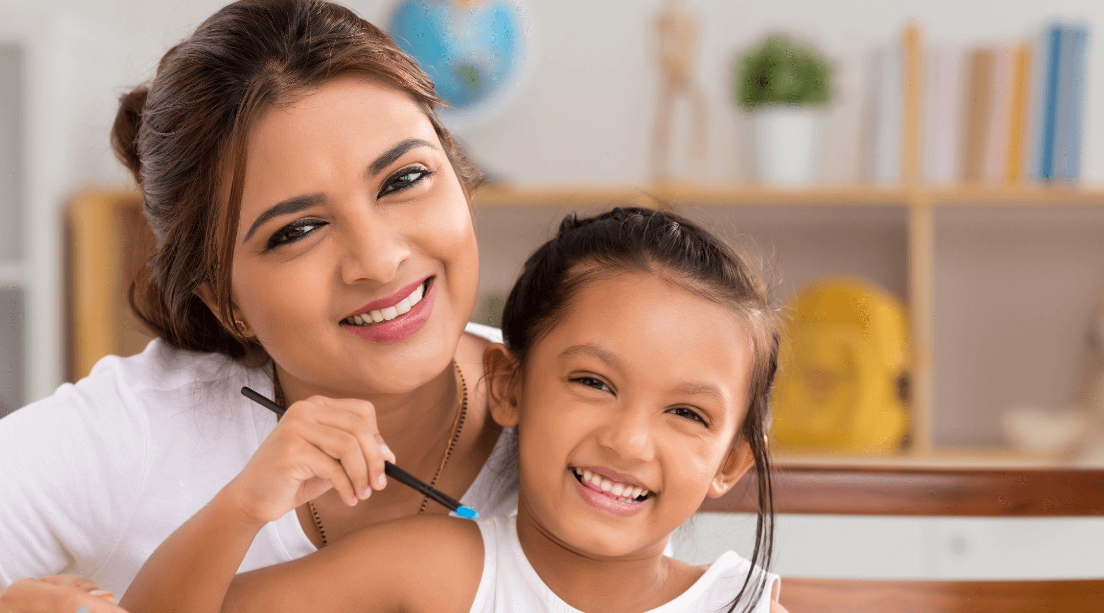 Smiling mother and daughter