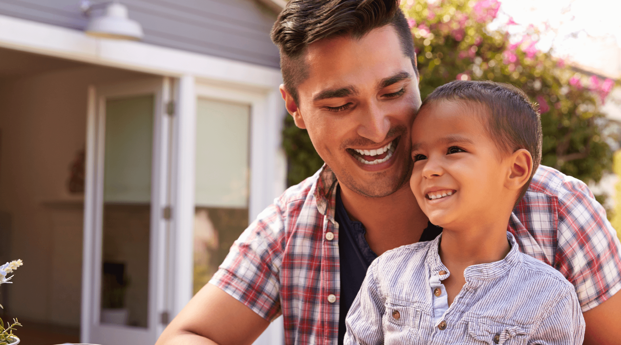 Smiling father and son