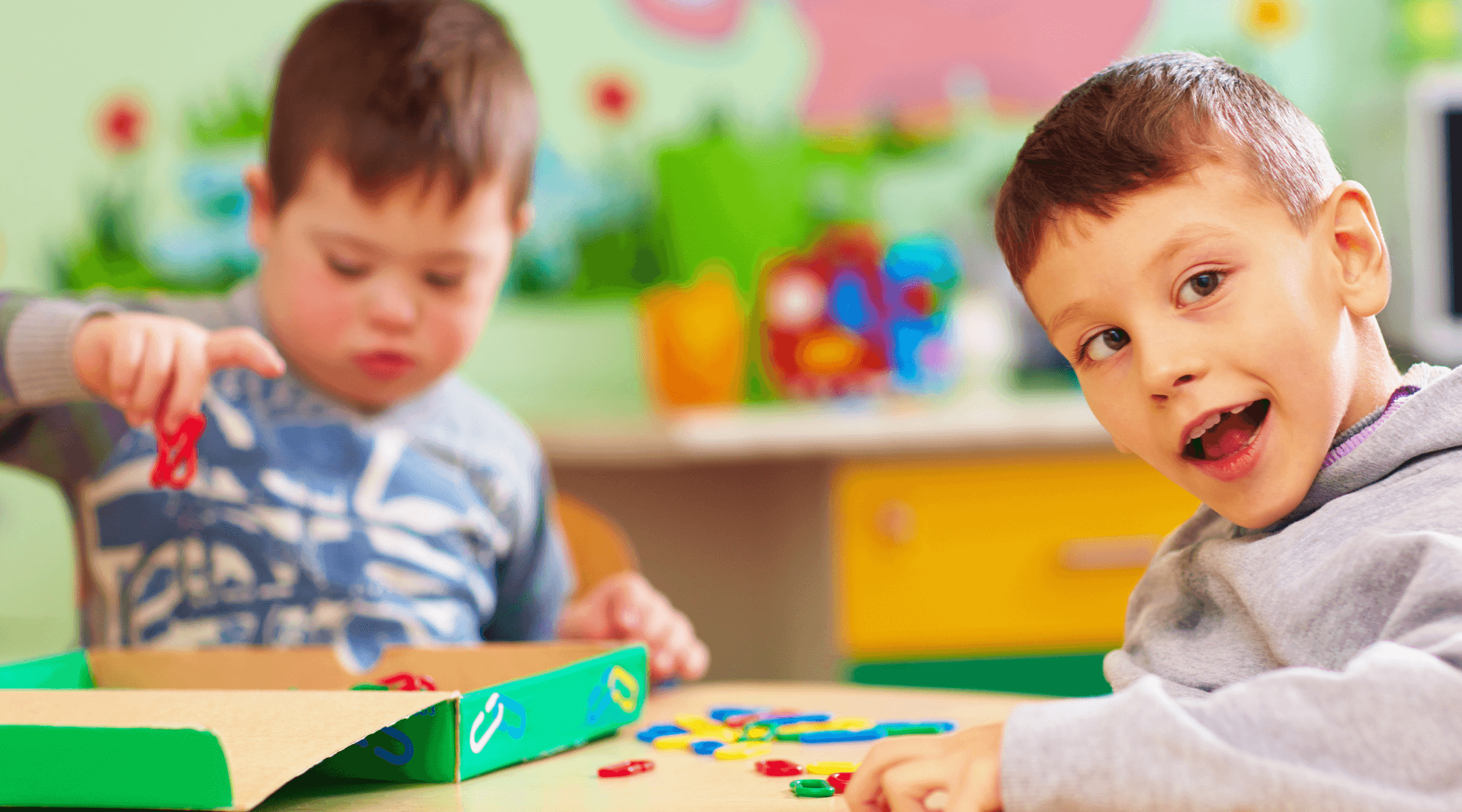 Two young children in a classroom